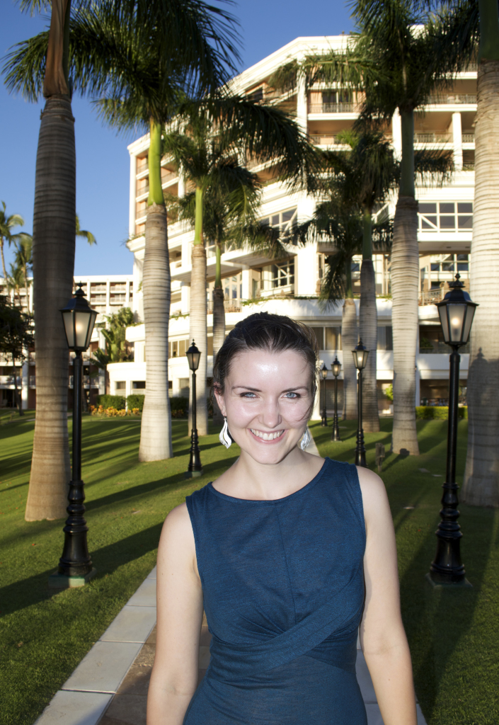 Ava stands under Wailea palms