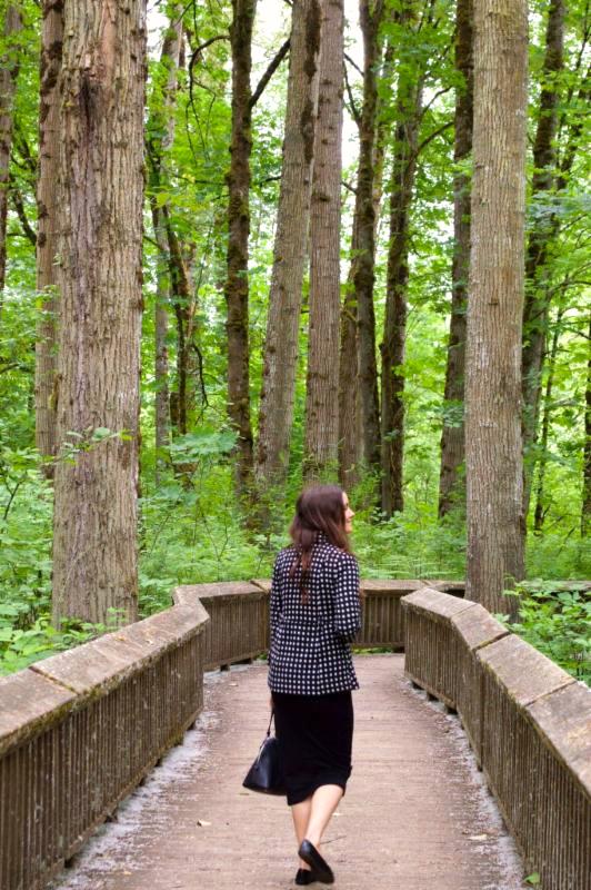 Ava walking in woods